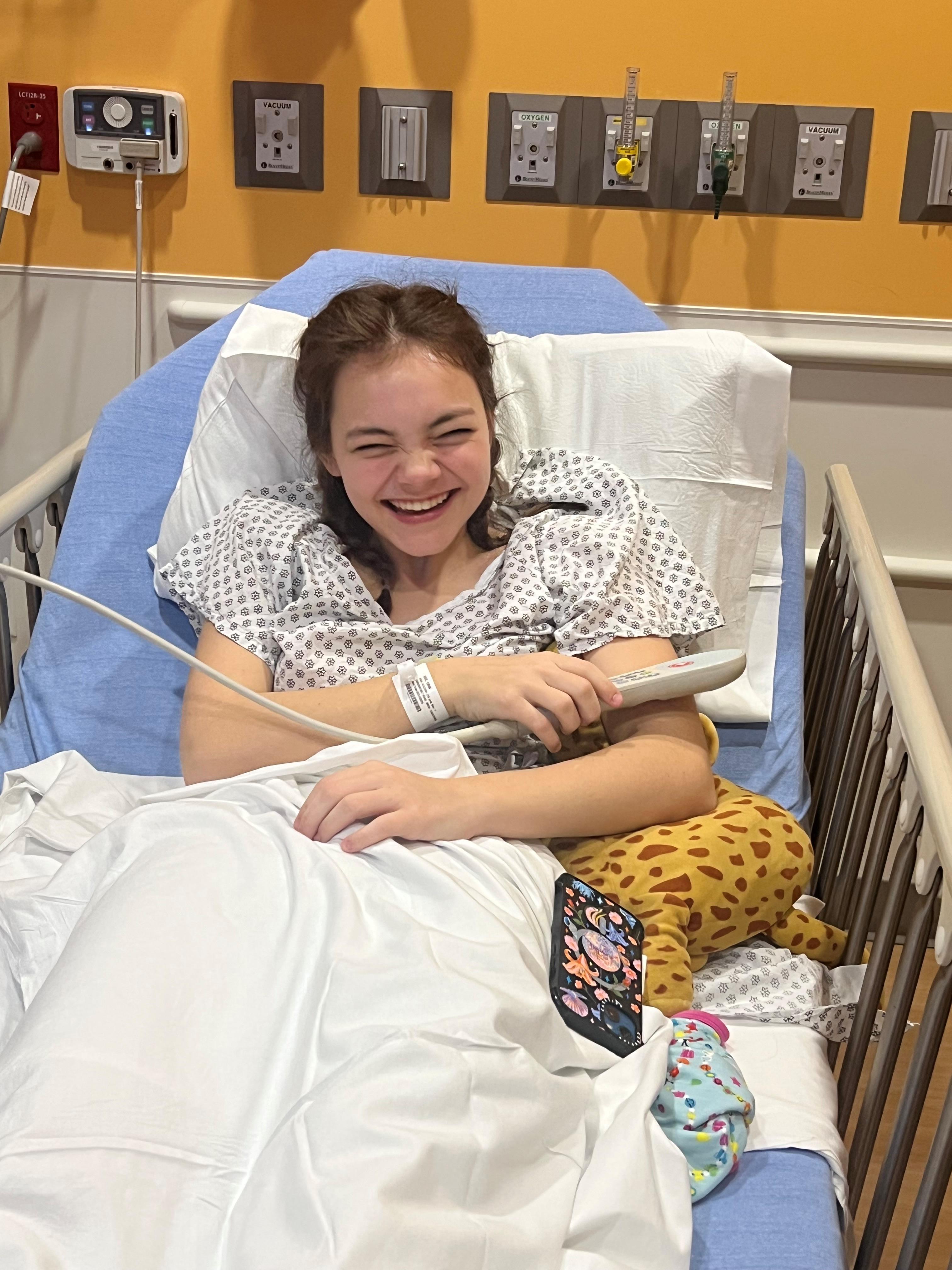 Erin Gee, Louisiana teen tennis player, smiles in a hospital bed at Manning Family Children's